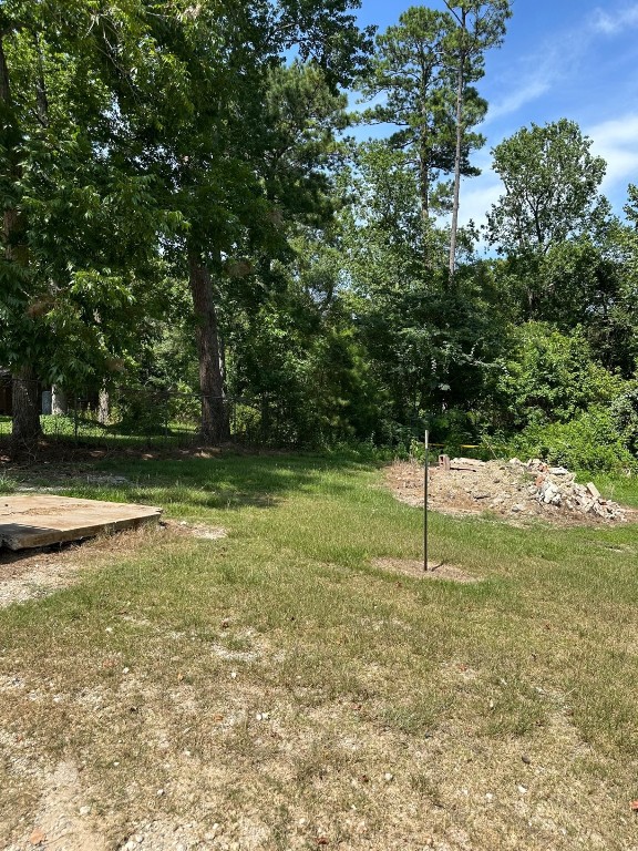 95 Rene Or Cr Dayton, TX 77535 - Photo 3 of 3 a swimming pool with lots of tress in it