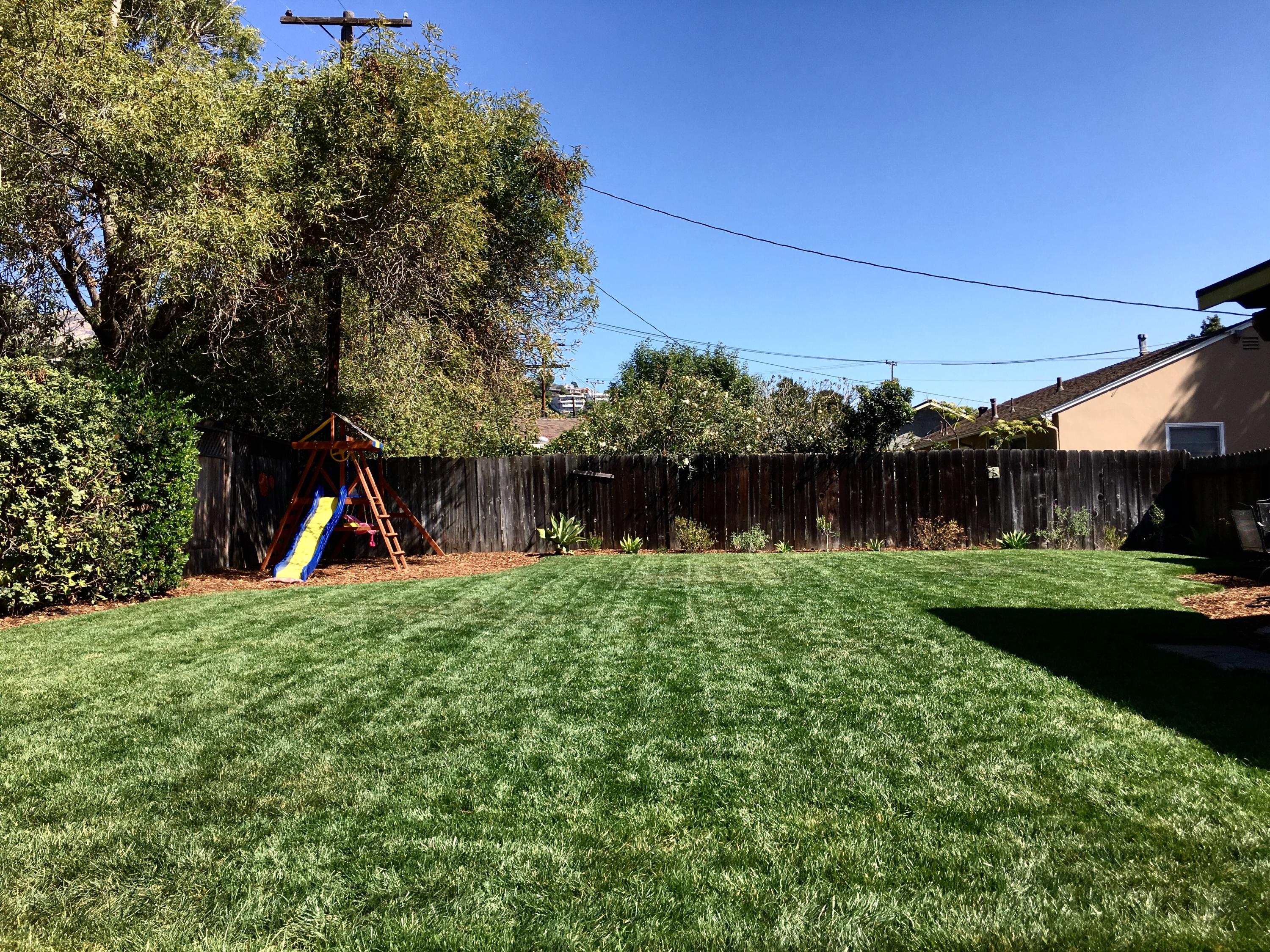3048 Paseo Tranquillo Santa Barbara, CA 93105 - Photo 17 of 19 a backyard of a house with plants and wooden fence