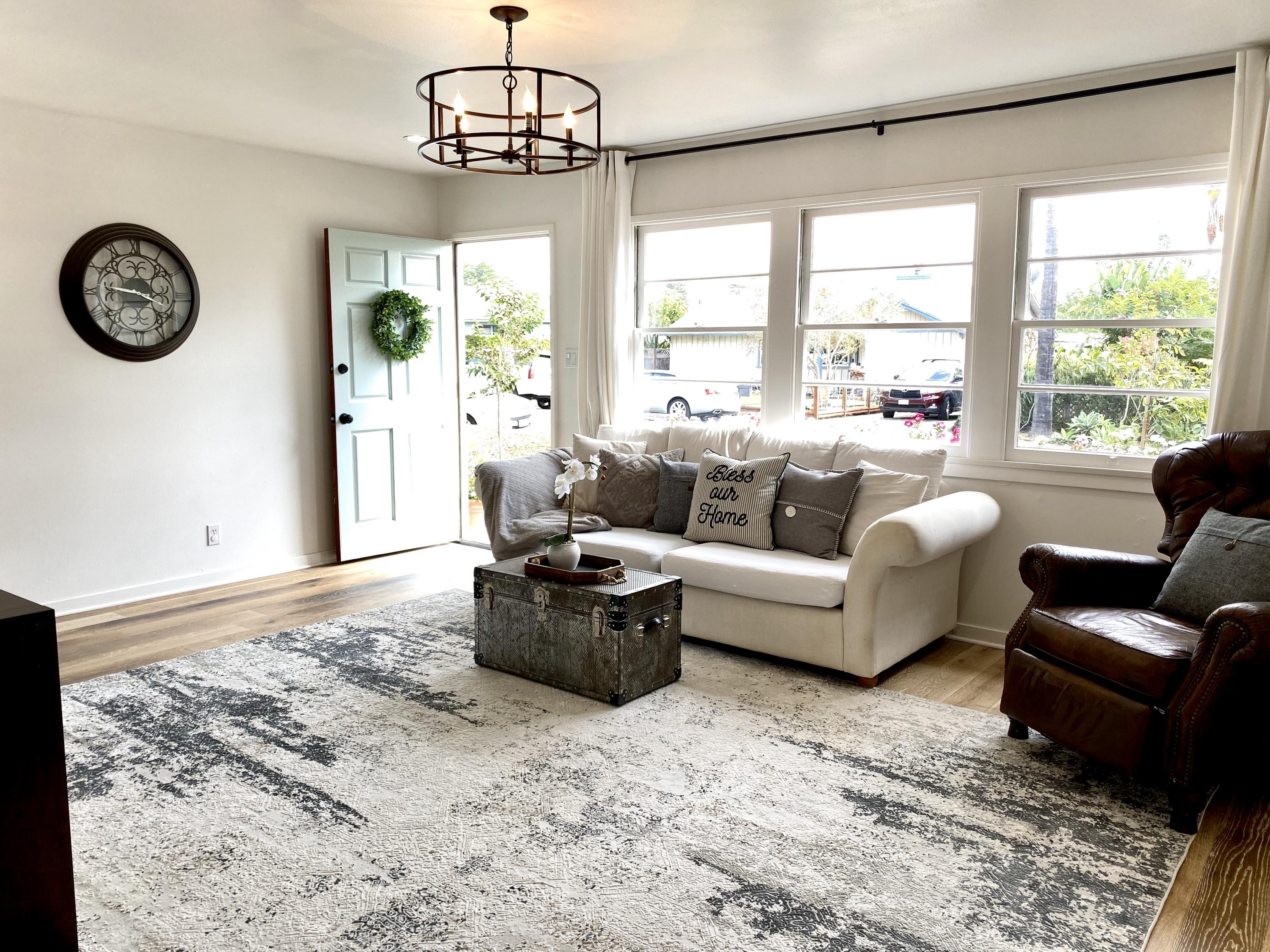 3048 Paseo Tranquillo Santa Barbara, CA 93105 - Photo 5 of 19 a living room with furniture a window and a clock