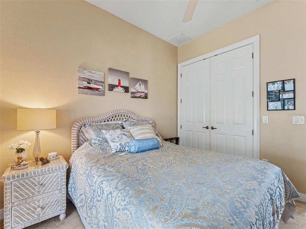 8910 Jericho Road Weeki Wachee, FL 34613 - Photo 39 of 52 a bedroom with a bed and a night stand
