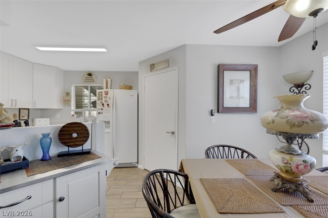 698 South Racetrack Road, Unit 1614 Henderson, NV 89015 - Photo 18 of 35 Clean lines and a spacious layout define this combined kitchen and dining area, ideal for relaxed entertaining.