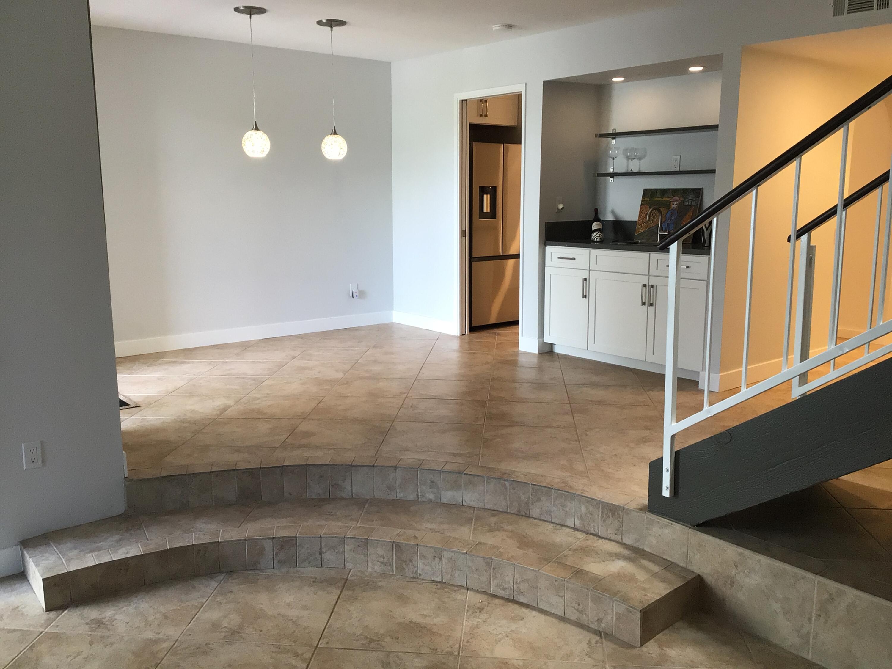 618 Violeta Drive Palm Springs, CA 92262 - Photo 11 of 35 a view of a hallway with wooden cabinets