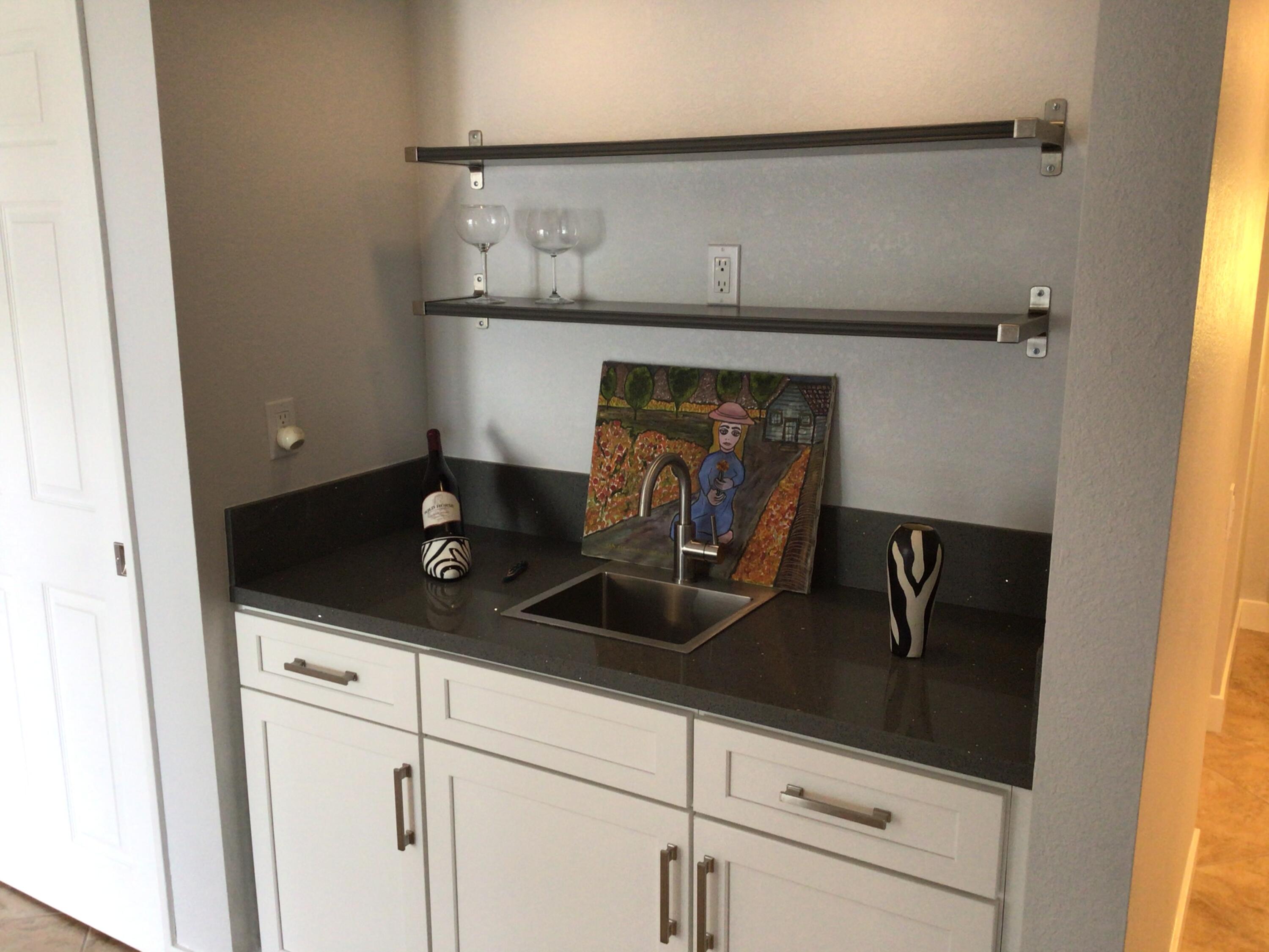 618 Violeta Drive Palm Springs, CA 92262 - Photo 12 of 35 a kitchen with a sink and cabinets