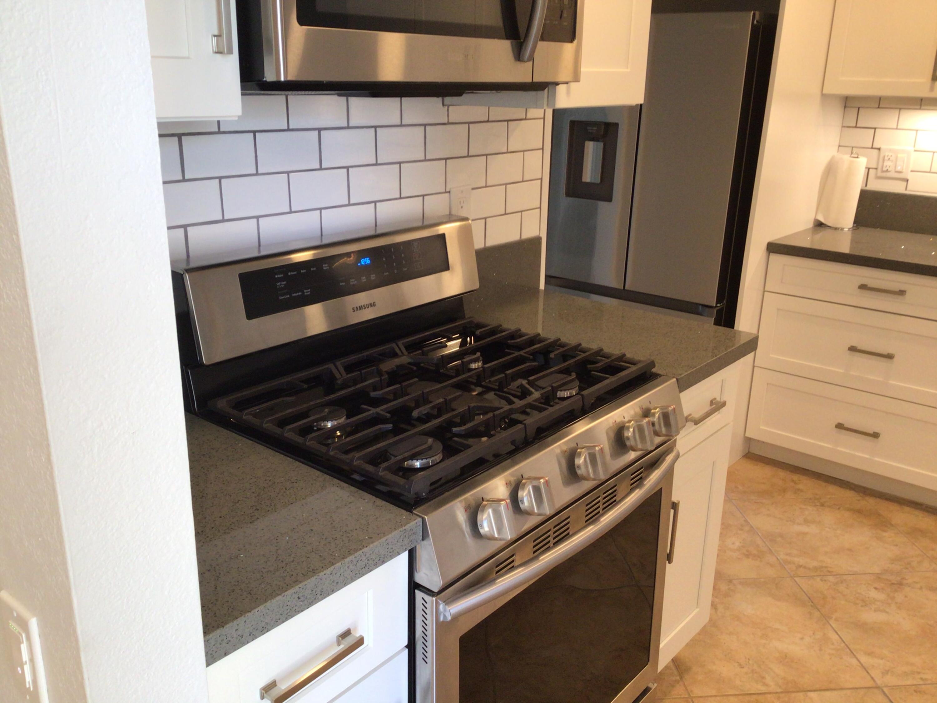 618 Violeta Drive Palm Springs, CA 92262 - Photo 13 of 35 a stove top oven sitting inside of a kitchen