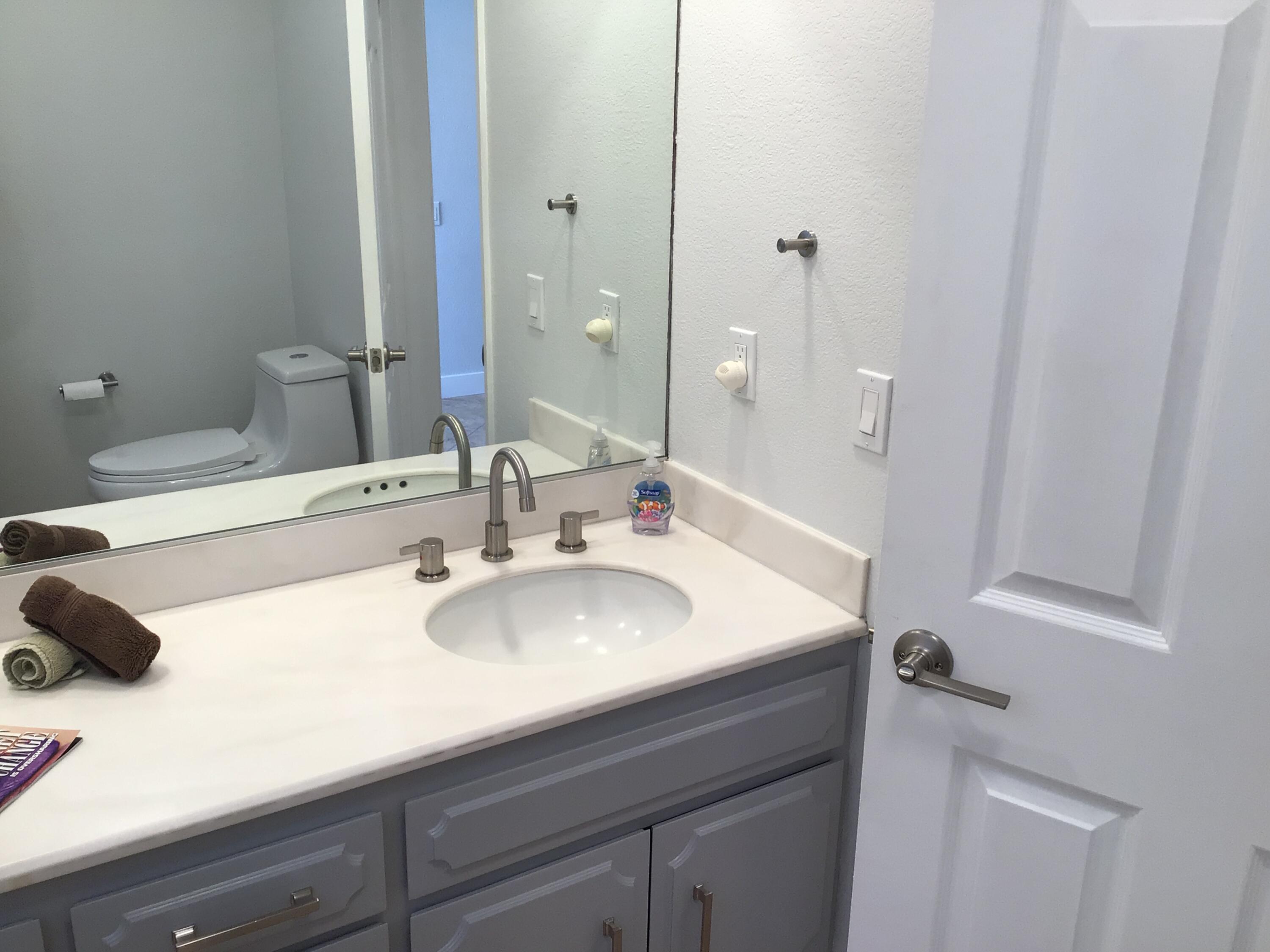 618 Violeta Drive Palm Springs, CA 92262 - Photo 20 of 35 a bathroom with a sink and a mirror