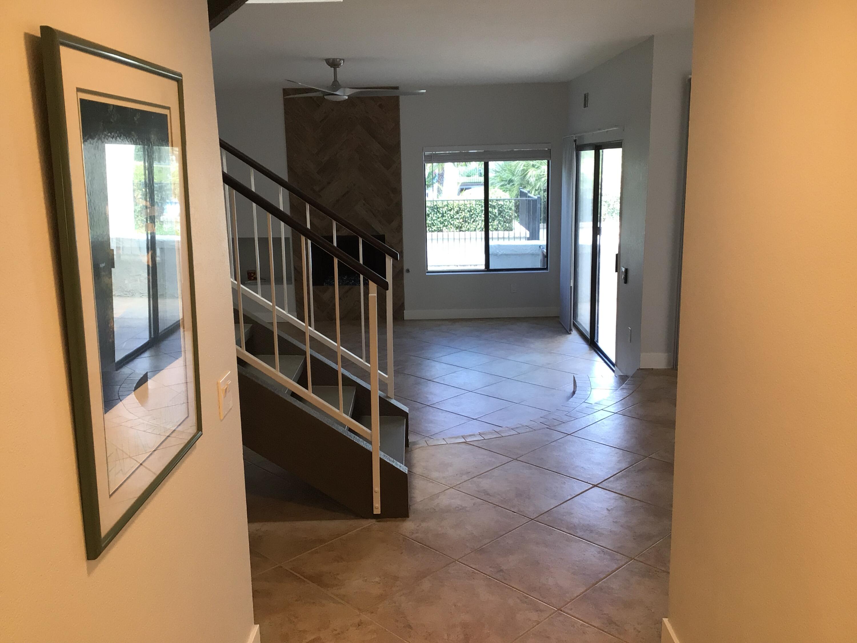 618 Violeta Drive Palm Springs, CA 92262 - Photo 22 of 35 a view of a hallway with windows and stairs