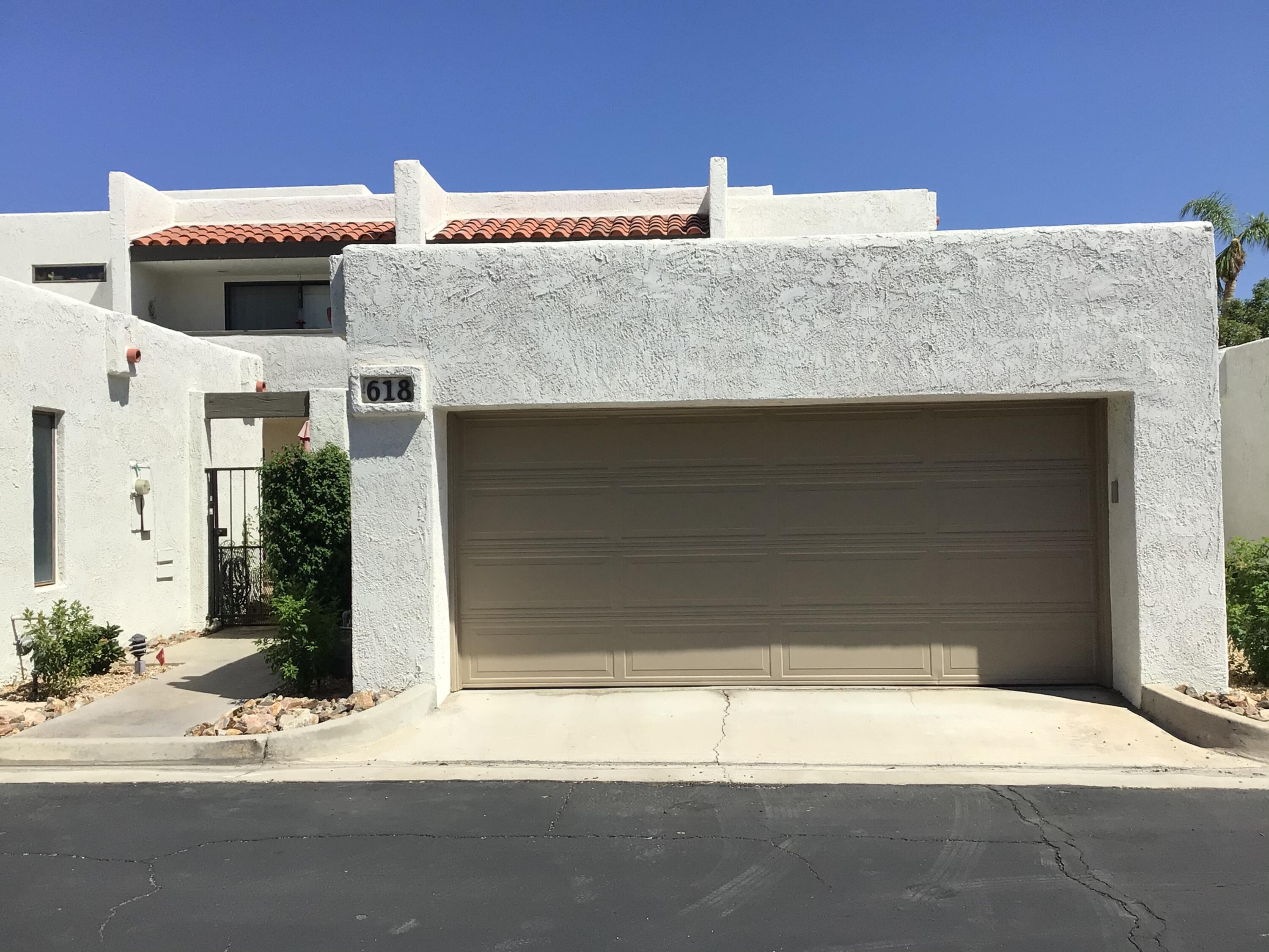 618 Violeta Drive Palm Springs, CA 92262 - Photo 7 of 35 a front view of a house with a garage