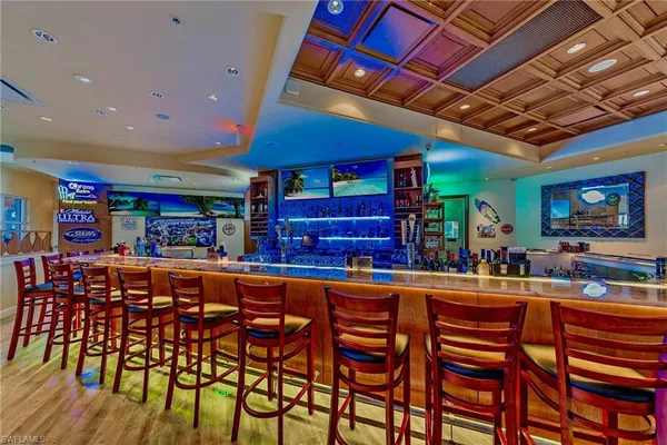 a view of swimming pool with a table and chairs