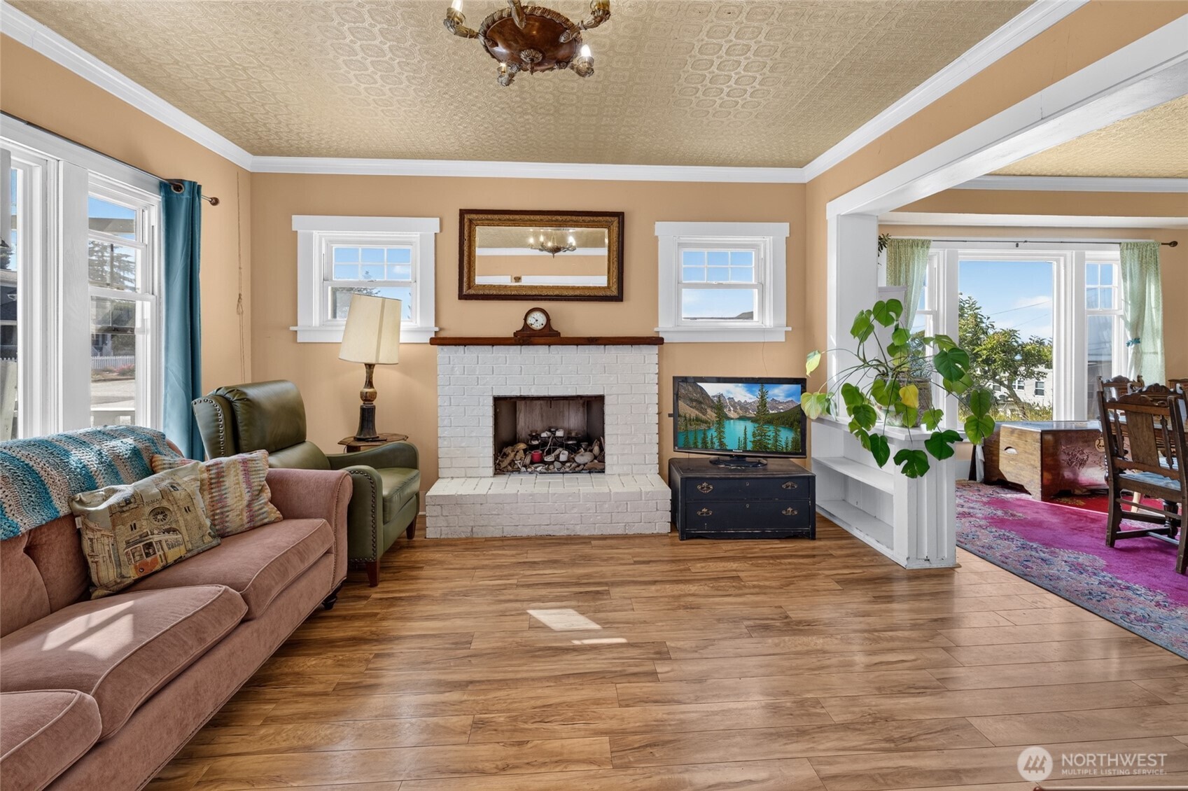 237 West 3rd Street Port Angeles, WA 98362 - Photo 8 of 40 a living room with furniture and a fireplace