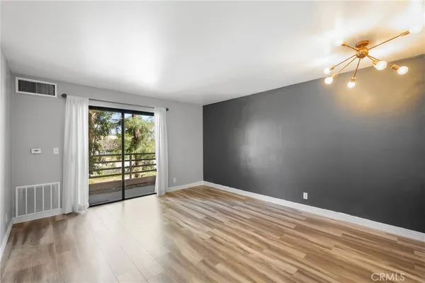 a kitchen with stainless steel appliances a refrigerator and a stove