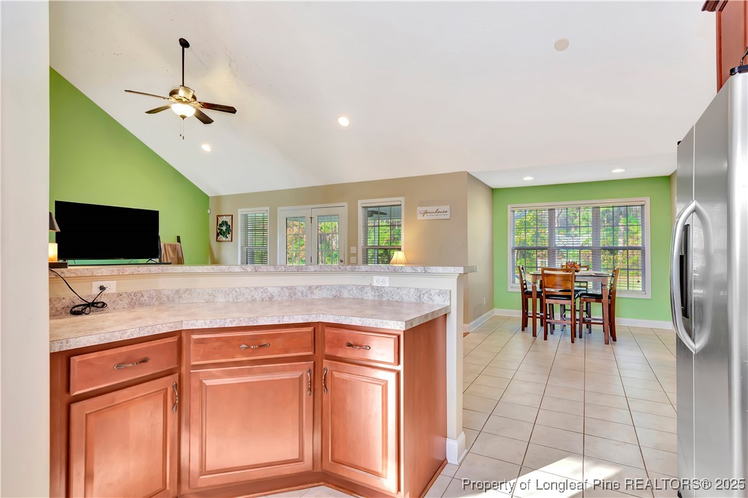 7453 7th Street Road Lumberton, NC 28358 - Photo 14 of 37 a kitchen with stainless steel appliances granite countertop a sink and a refrigerator