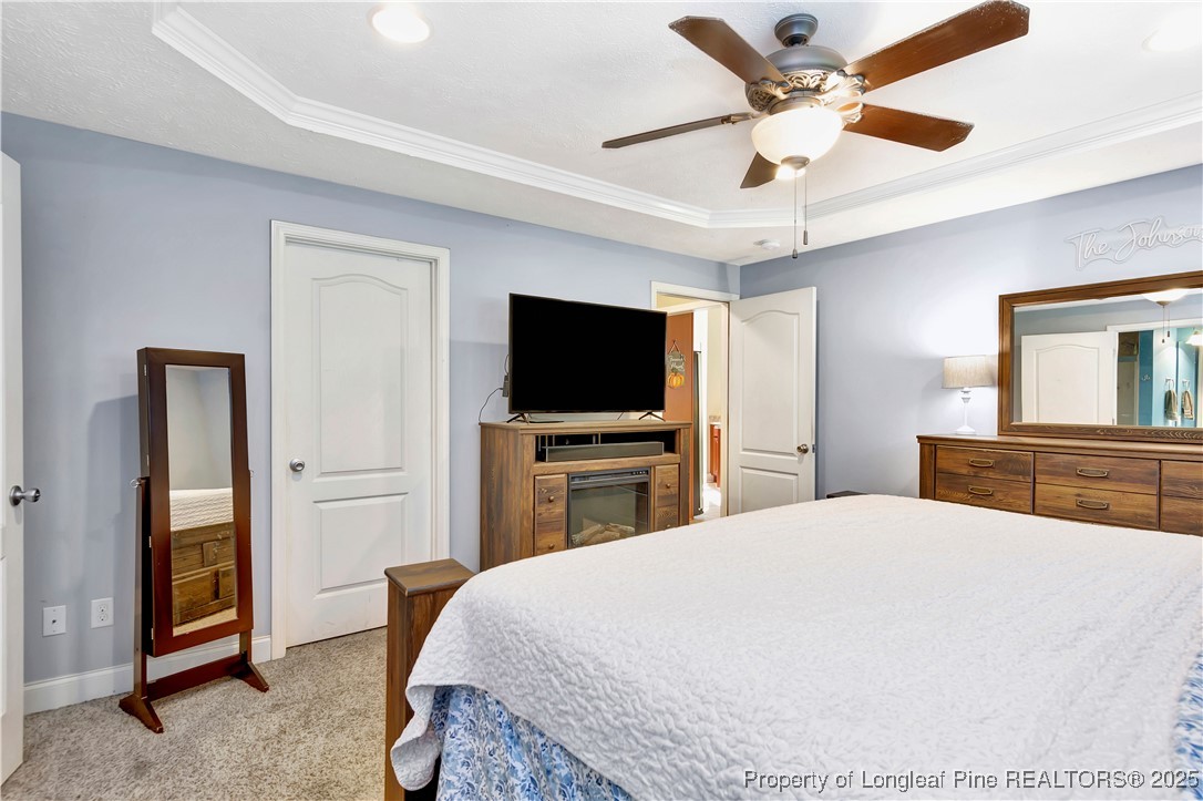 7453 7th Street Road Lumberton, NC 28358 - Photo 22 of 37 a bedroom with a bed and a flat screen tv