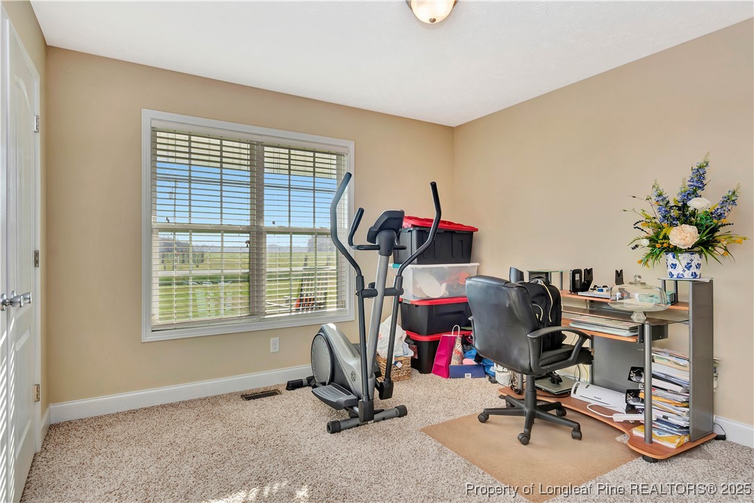 7453 7th Street Road Lumberton, NC 28358 - Photo 26 of 37 a view of a workspace with furniture and a window