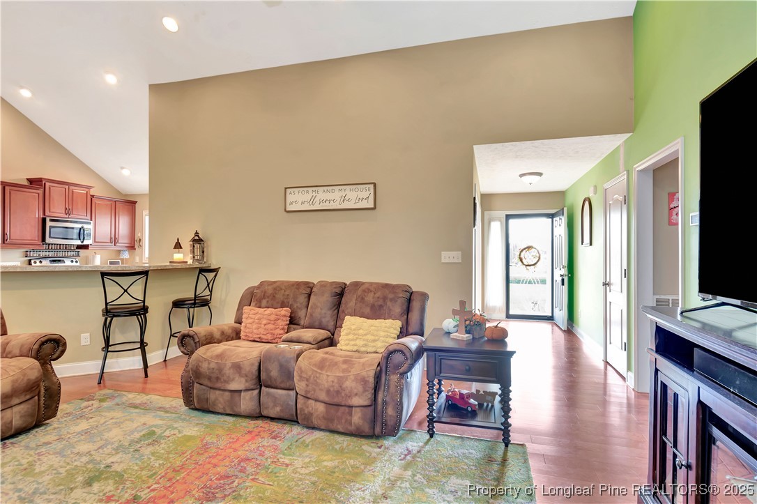 7453 7th Street Road Lumberton, NC 28358 - Photo 8 of 37 a living room with furniture wooden floor and a flat screen tv