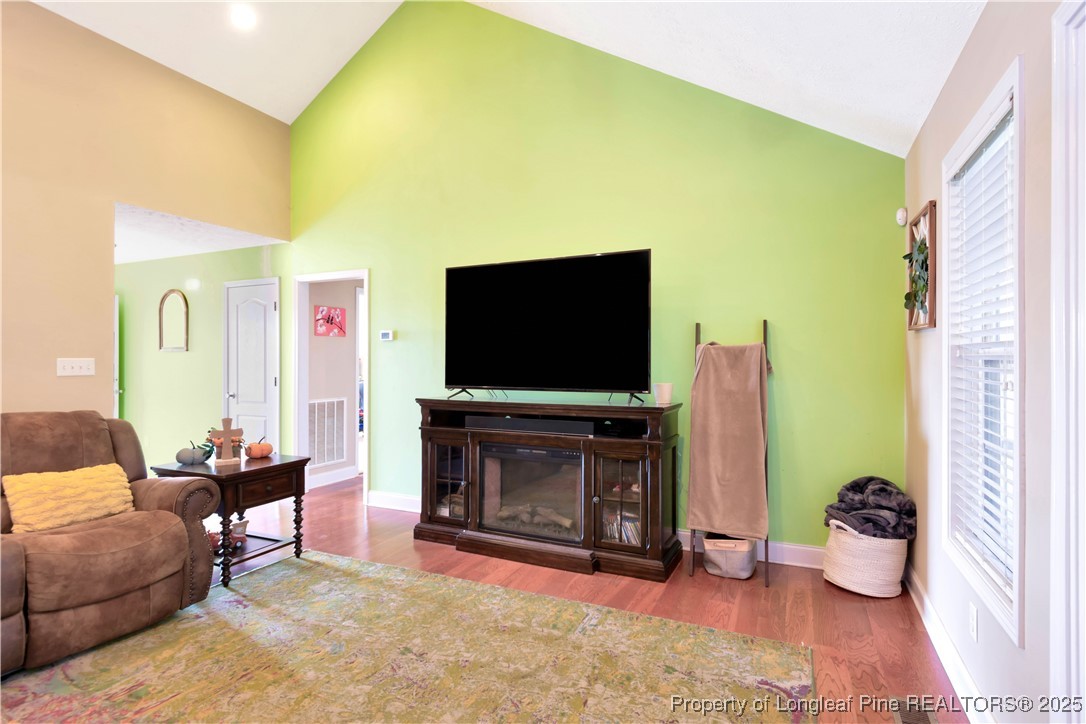 7453 7th Street Road Lumberton, NC 28358 - Photo 9 of 37 a living room with furniture and a flat screen tv