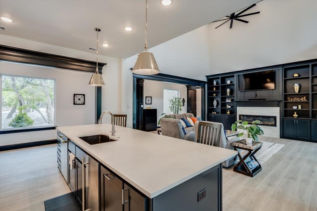 124 Cote D Azur Chico, TX 76431 - Photo 40 of 40 a kitchen with a stove a refrigerator and a dining table