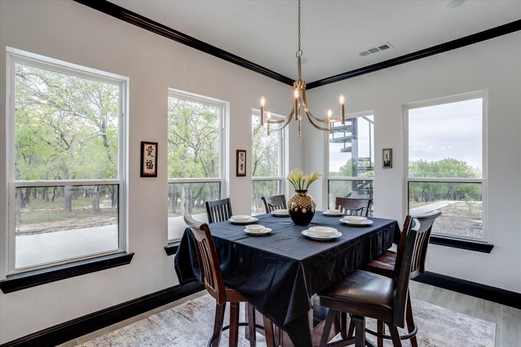 124 Cote D Azur Chico, TX 76431 - Photo 10 of 40 a view of a dining room with furniture window and outside view