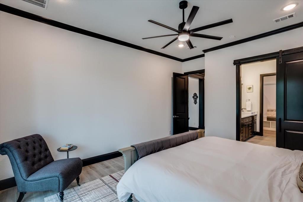124 Cote D Azur Chico, TX 76431 - Photo 12 of 40 a bedroom with a bed and a chair