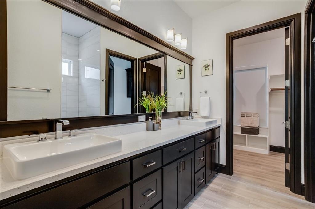 124 Cote D Azur Chico, TX 76431 - Photo 13 of 40 a bathroom with a double vanity sink and a mirror