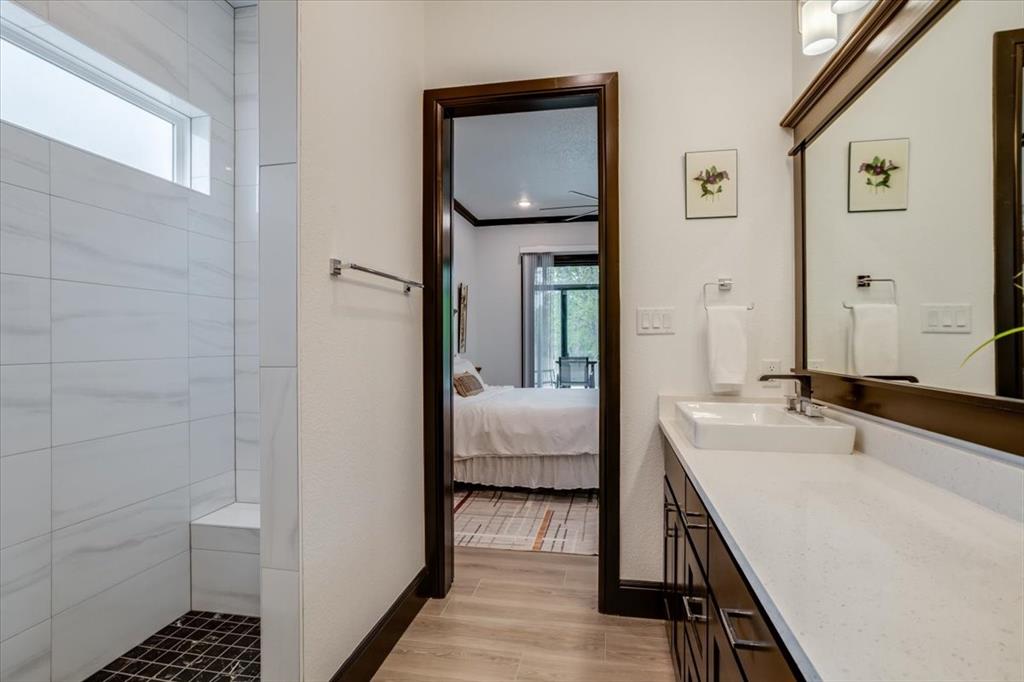 124 Cote D Azur Chico, TX 76431 - Photo 14 of 40 a en suite bathroom with a sink and a mirror