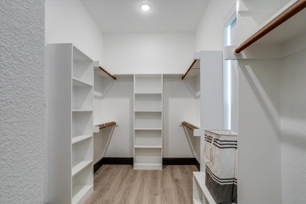 124 Cote D Azur Chico, TX 76431 - Photo 16 of 40 a view of walk in closet with empty racks
