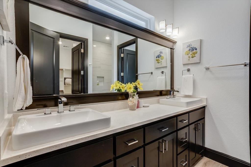 124 Cote D Azur Chico, TX 76431 - Photo 19 of 40 a bathroom with a double vanity sink and a mirror