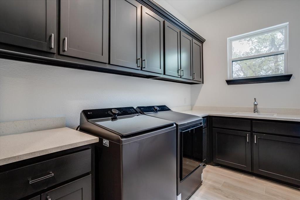 124 Cote D Azur Chico, TX 76431 - Photo 23 of 40 a kitchen with stainless steel appliances a stove a sink and cabinets