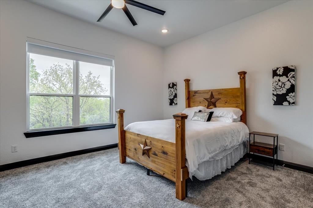 124 Cote D Azur Chico, TX 76431 - Photo 27 of 40 a bedroom with a bed and a window