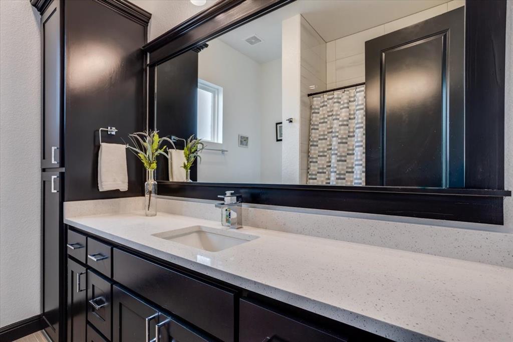 124 Cote D Azur Chico, TX 76431 - Photo 29 of 40 a bathroom with a sink and a mirror