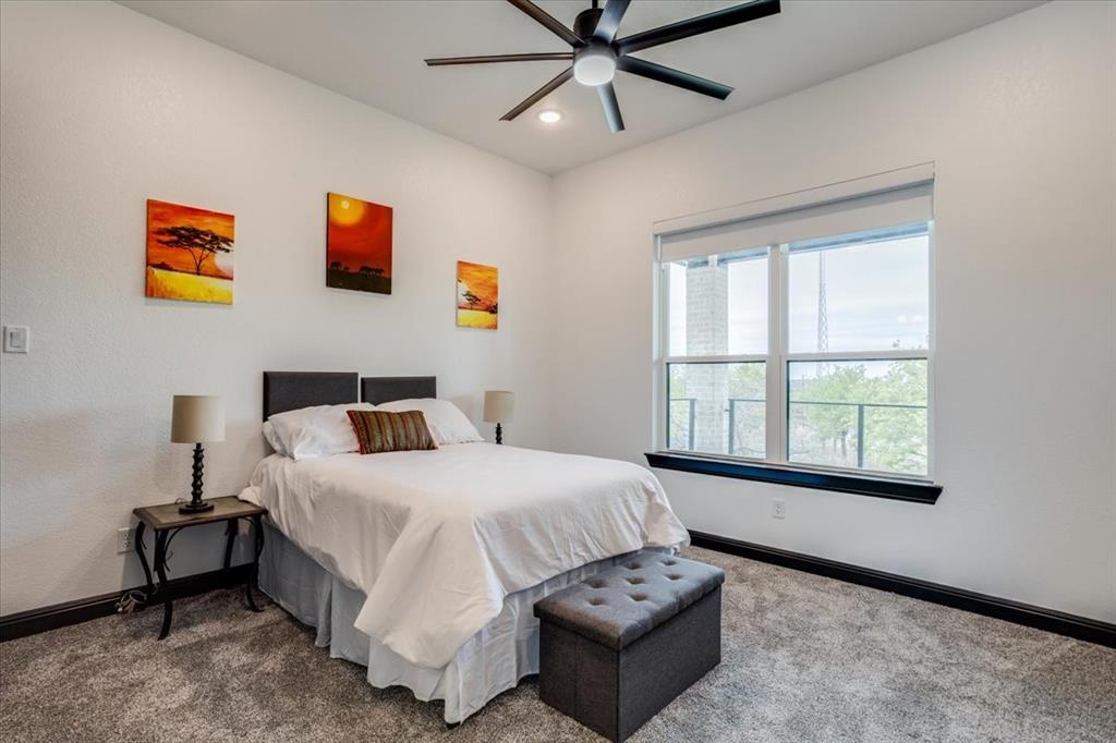 124 Cote D Azur Chico, TX 76431 - Photo 30 of 40 a bedroom with a bed and a window