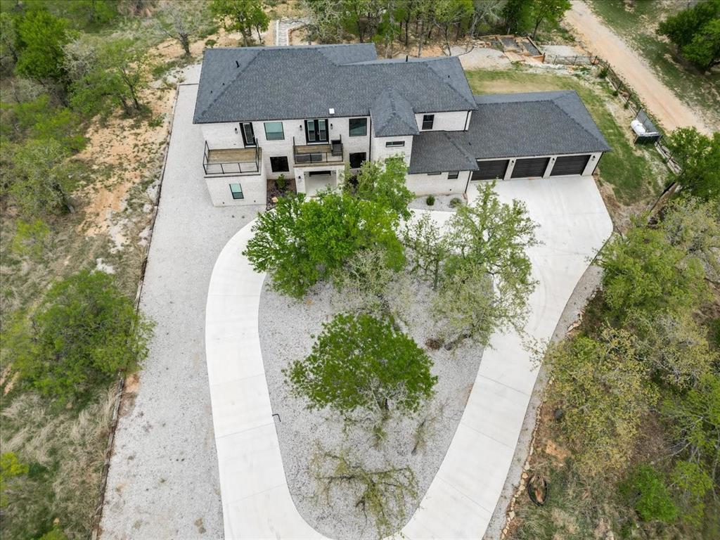 124 Cote D Azur Chico, TX 76431 - Photo 38 of 40 an aerial view of a house with a yard and pool