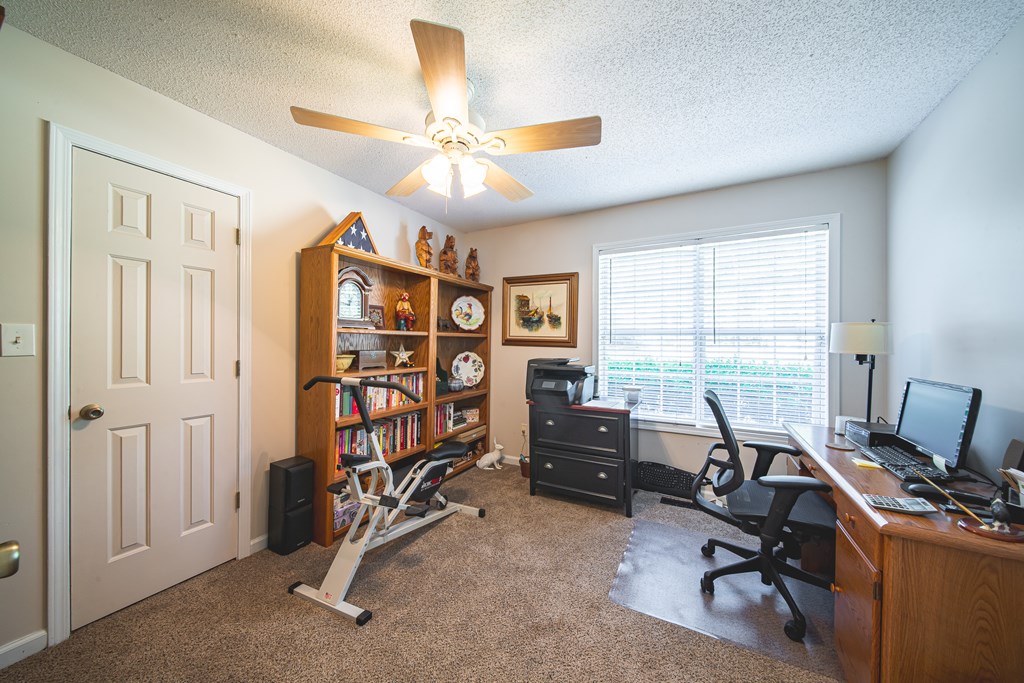 200 Lake Amah Lee Road Hampton, GA 30228 - Photo 17 of 29 a view of a livingroom with workspace and a window