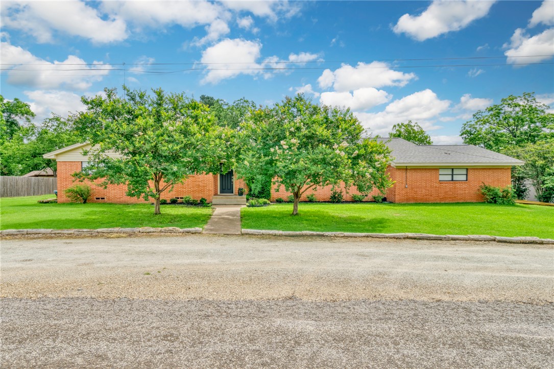 801 North Center Street Franklin, TX 77856 - Photo 1 of 32 View of property hidden behind natural elements with brick siding
