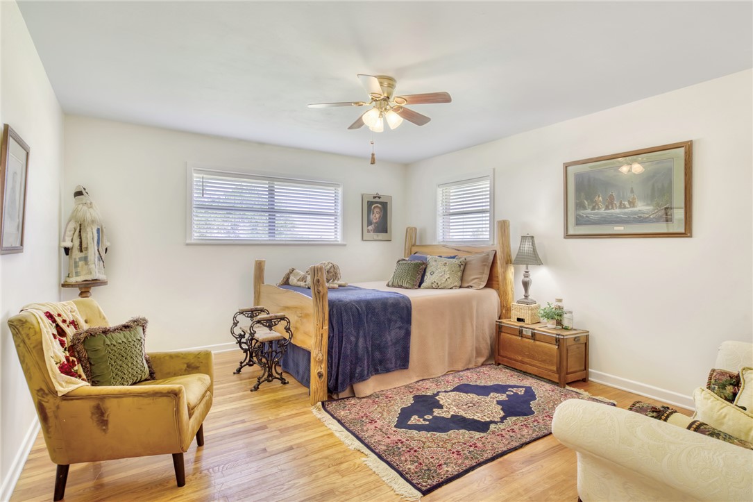 801 North Center Street Franklin, TX 77856 - Photo 23 of 32 Bedroom with wood finished floors and baseboards