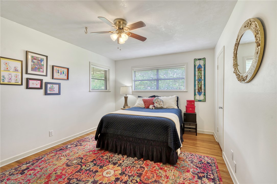 801 North Center Street Franklin, TX 77856 - Photo 24 of 32 Bedroom with light wood-style floors, ceiling fan, and baseboards