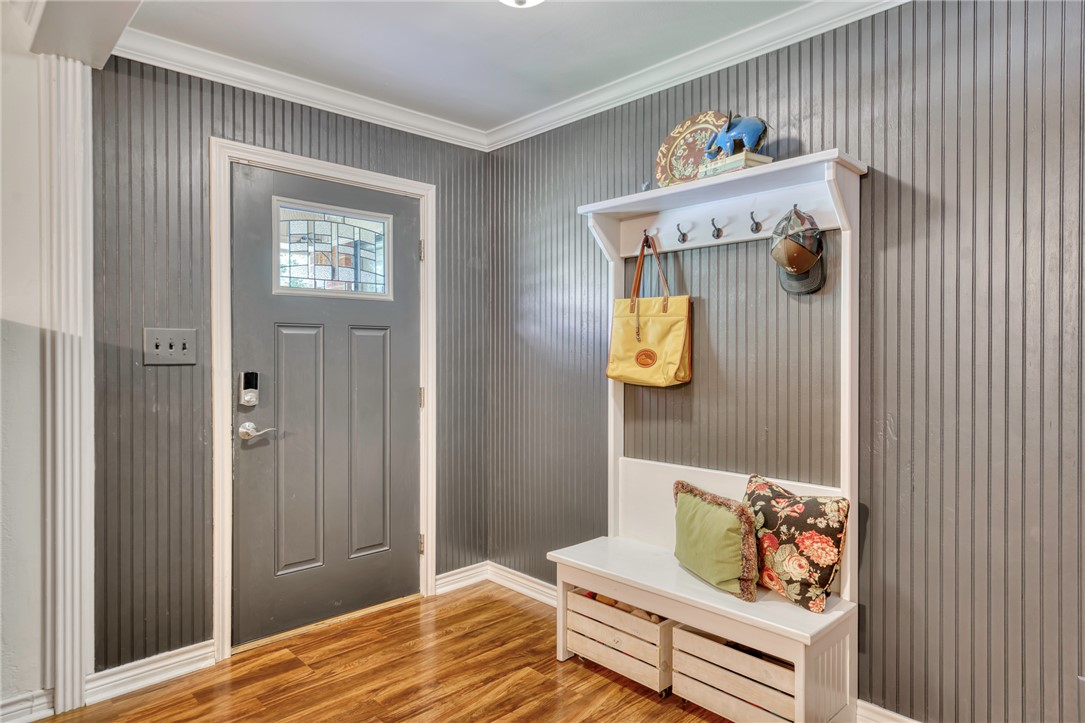 801 North Center Street Franklin, TX 77856 - Photo 7 of 32 Mudroom with crown molding, wood finished floors, and baseboards