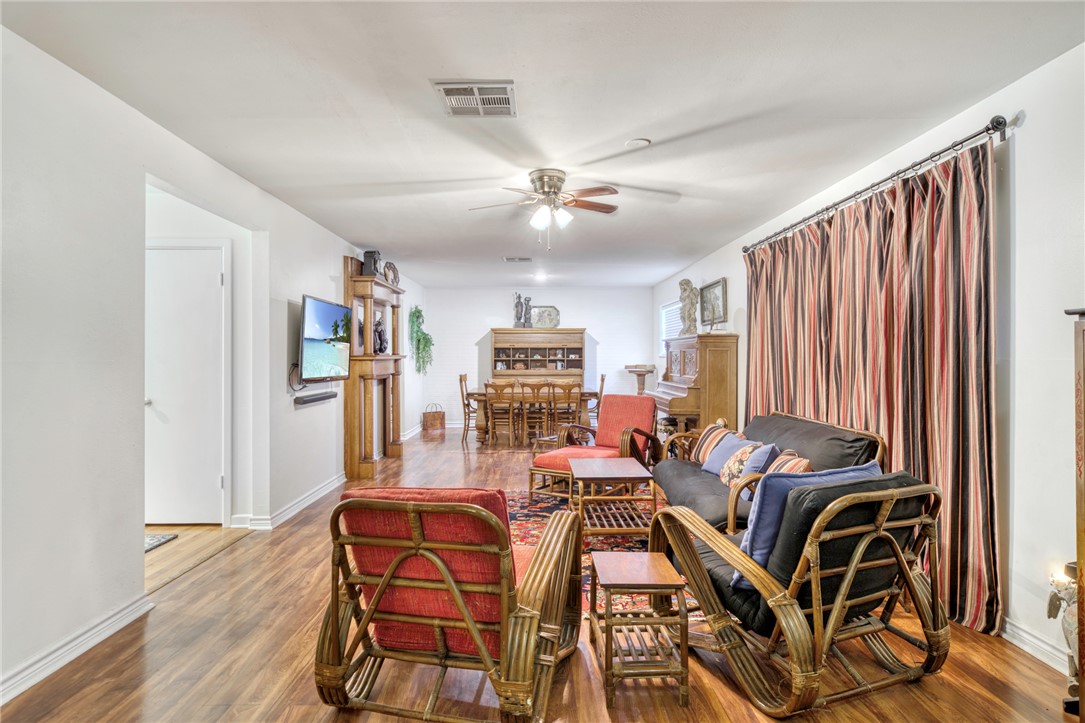 801 North Center Street Franklin, TX 77856 - Photo 9 of 32 Living area with a ceiling fan, wood finished floors, and baseboards