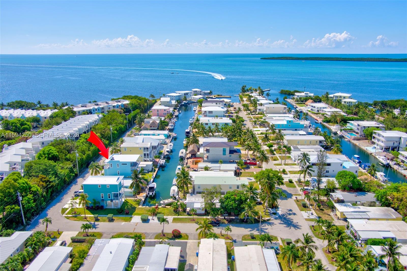 84 Coral Way Key Largo, FL 33037 - Photo 1 of 55 a view of a city with an ocean view