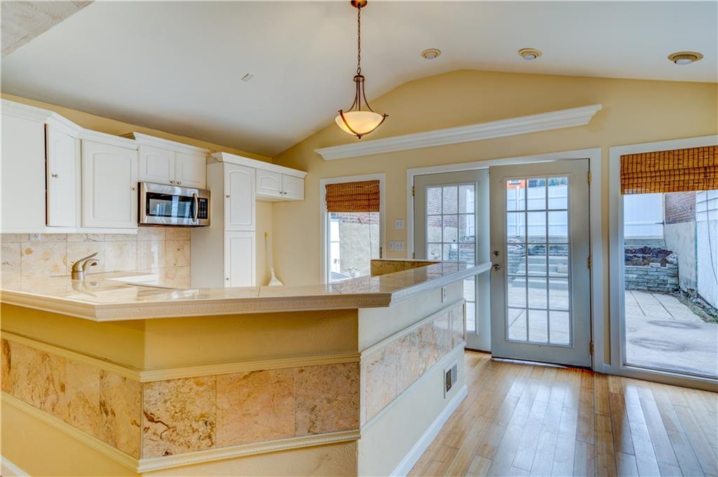 5264 Dresden Way Pittsburgh, PA 15201 - Photo 4 of 16 a kitchen with stainless steel appliances granite countertop a sink and cabinets
