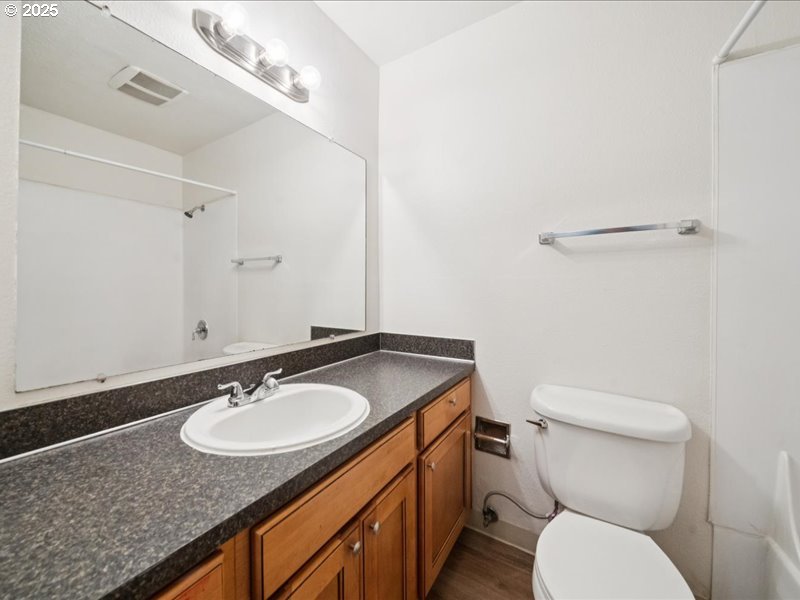 010 South Porter Street Portland, OR 97201 - Photo 8 of 11 a bathroom with a granite countertop sink and a mirror