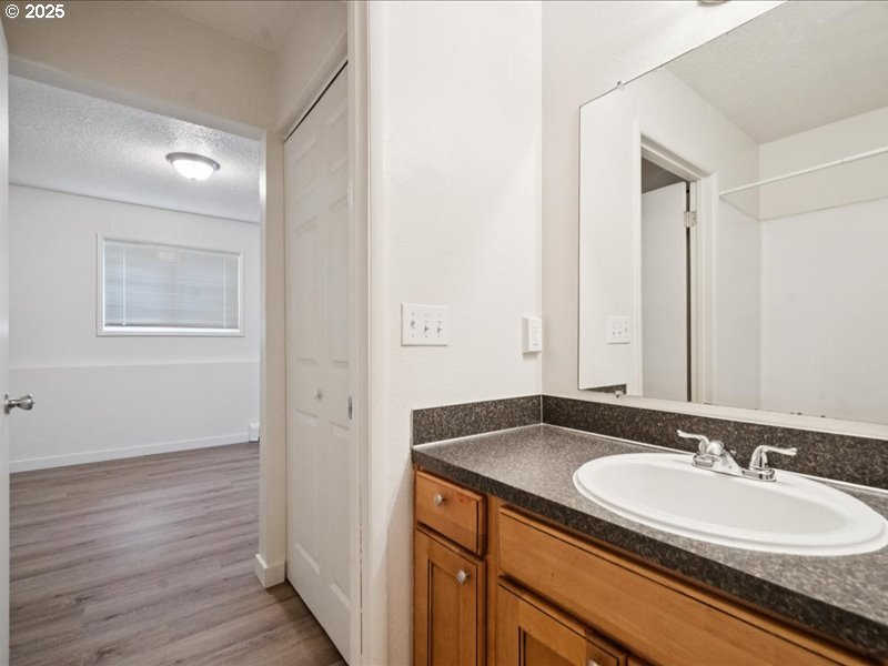 010 South Porter Street Portland, OR 97201 - Photo 9 of 11 a bathroom with a granite countertop sink and a mirror