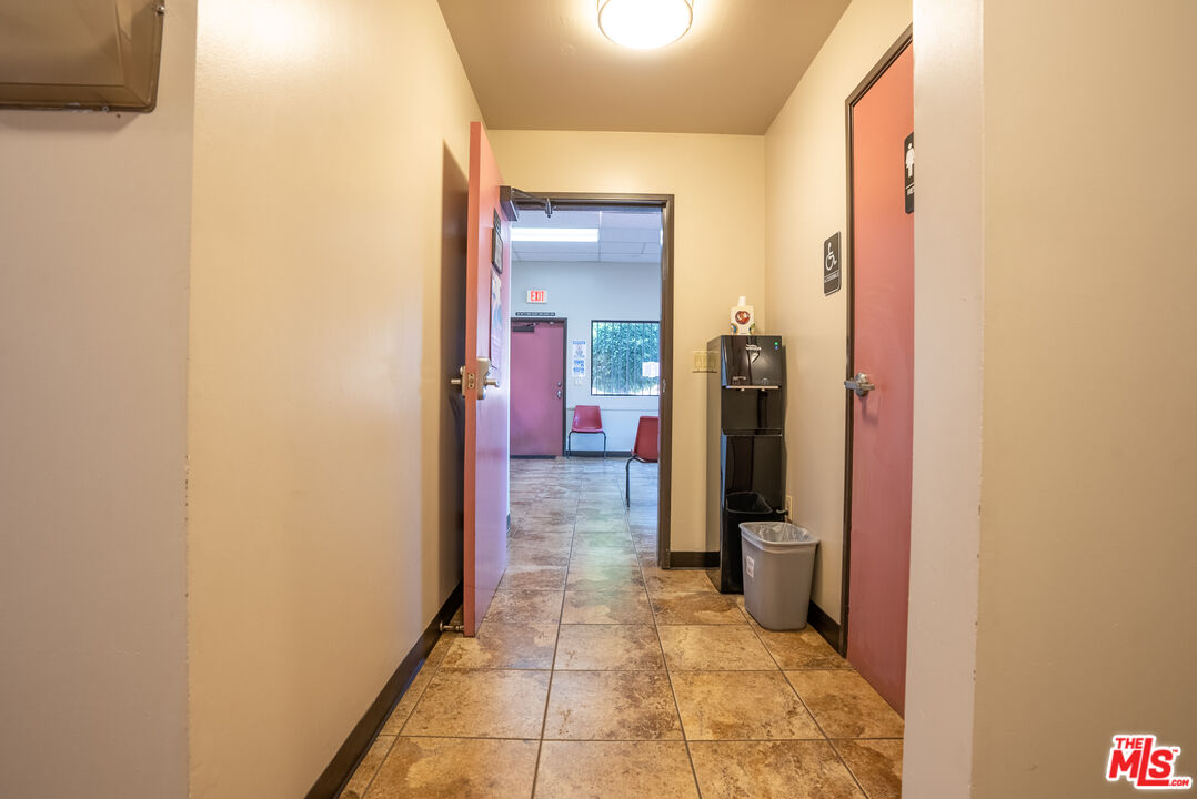 4946 Florence Avenue Bell, CA 90201 - Photo 13 of 72 a view of a hallway with a livingroom and a bathroom with sink