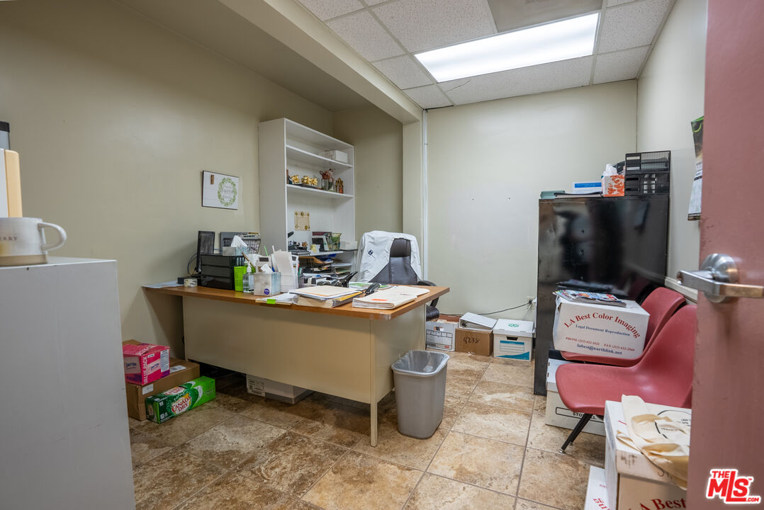 4946 Florence Avenue Bell, CA 90201 - Photo 19 of 72 a living room with furniture and a flat screen tv
