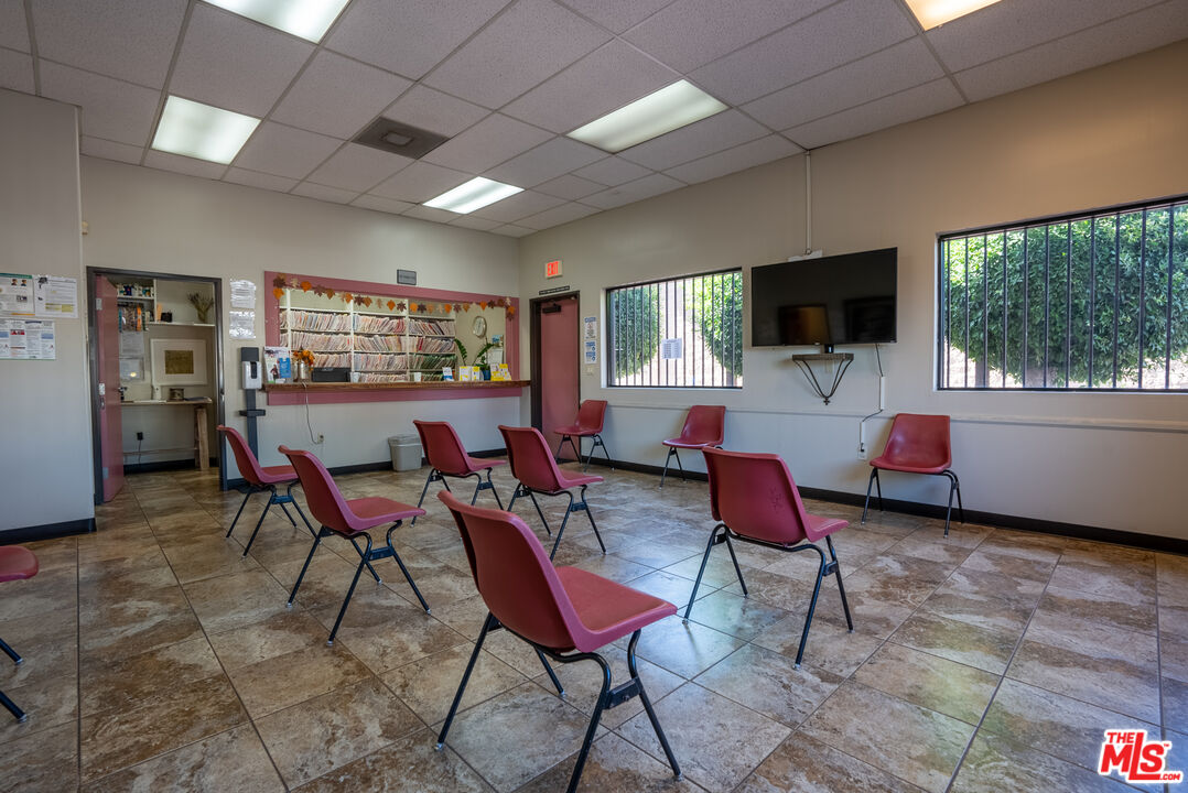 4946 Florence Avenue Bell, CA 90201 - Photo 23 of 72 a living room with furniture and a flat screen tv