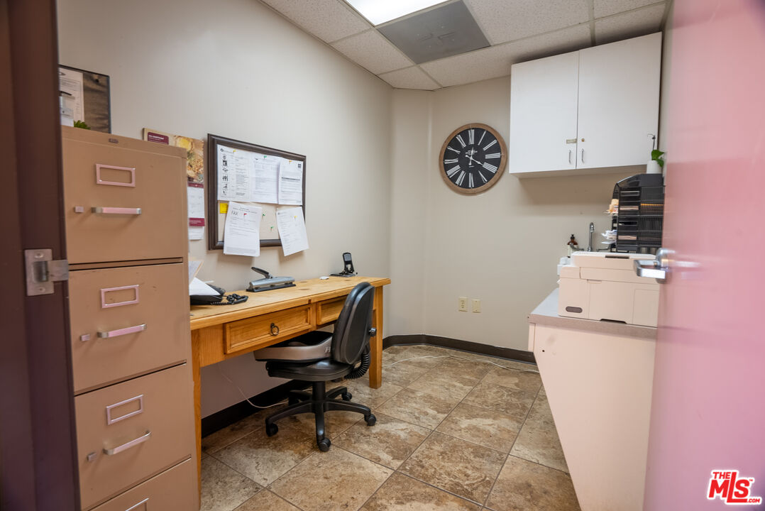 4946 Florence Avenue Bell, CA 90201 - Photo 3 of 72 a room with cabinets and wooden floor
