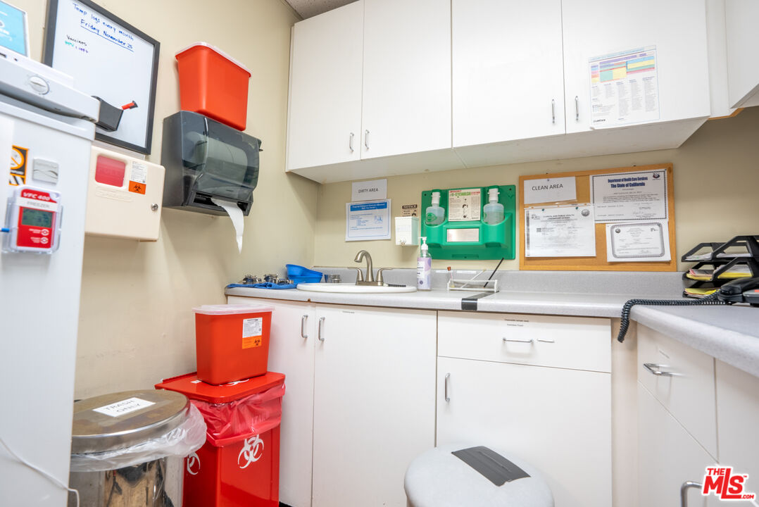4946 Florence Avenue Bell, CA 90201 - Photo 48 of 72 a kitchen with stainless steel appliances a sink and a refrigerator