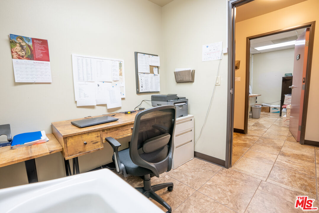 4946 Florence Avenue Bell, CA 90201 - Photo 56 of 72 a room with furniture a flat screen tv and a dresser
