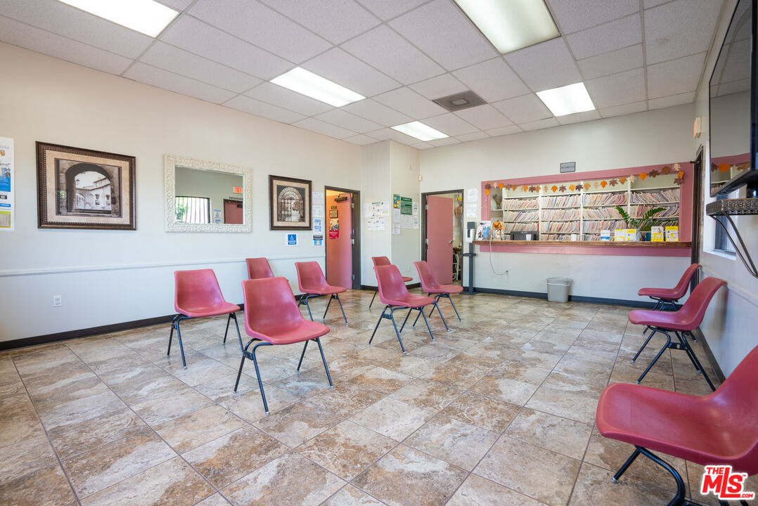 4946 Florence Avenue Bell, CA 90201 - Photo 66 of 72 a living room with furniture and a window