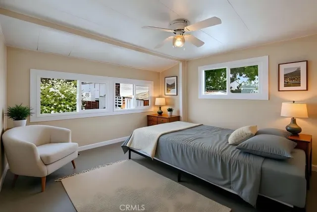 a bedroom with a bed and a couch