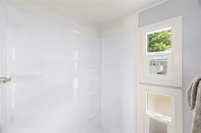 a picture of a bathroom with a window